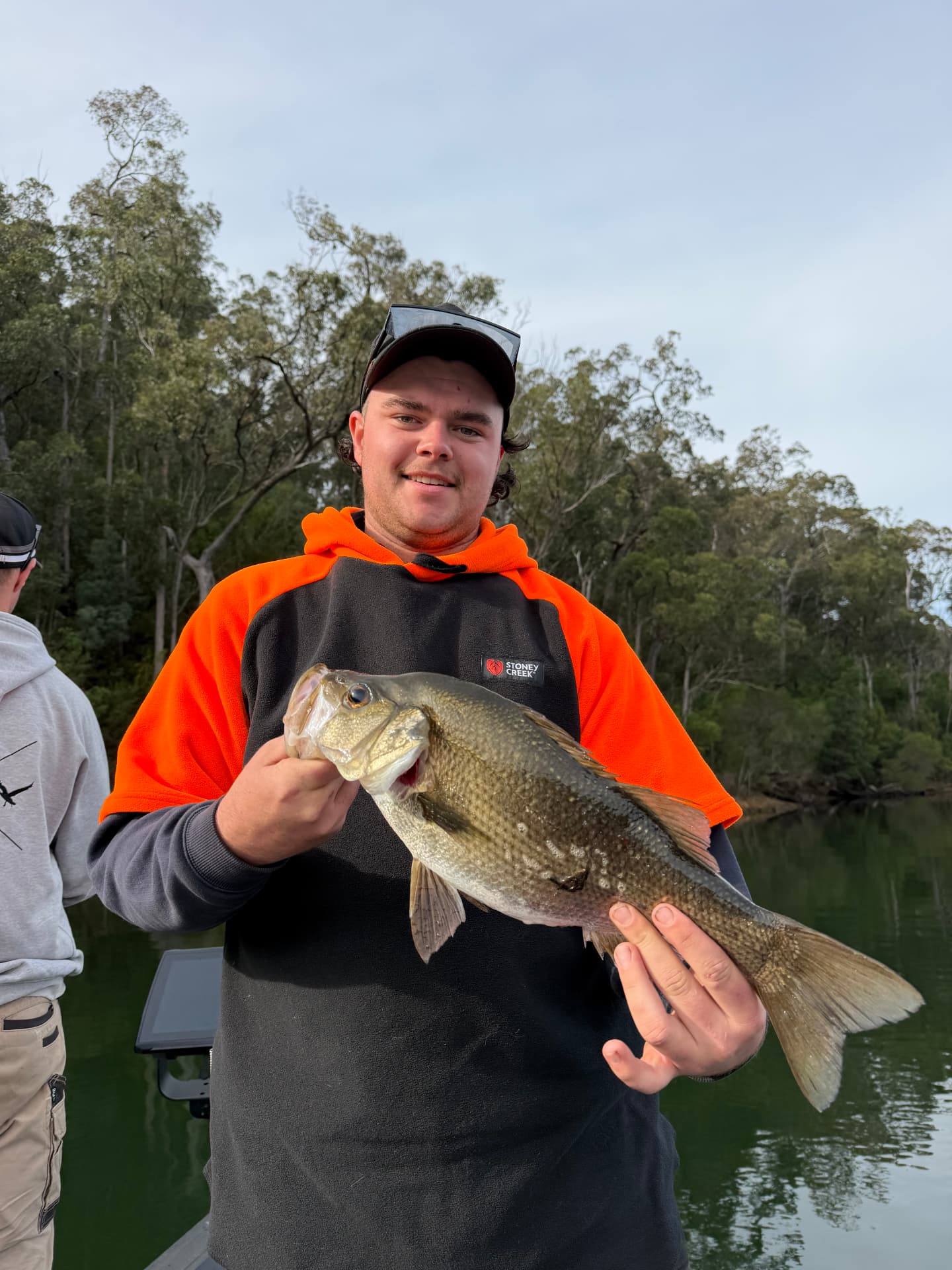 Brock holding a solid estuary perch caught on the Mallacoota lake system