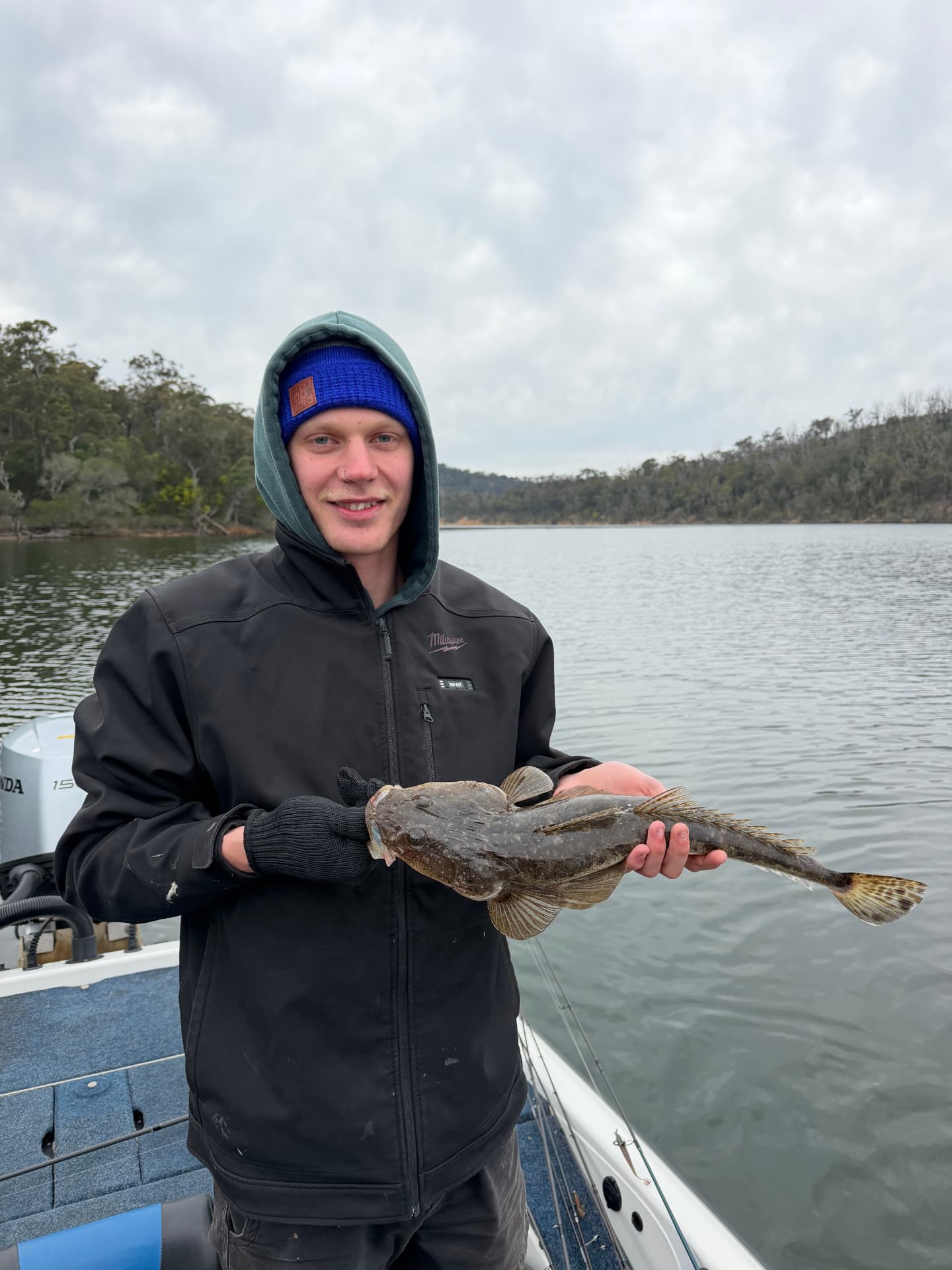Brock holding a dusky flathead caught on the Mallacoota lake system